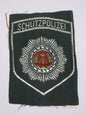 New East German Schutzpolizei insignia shoulder badge communist DDR volkspolizei
